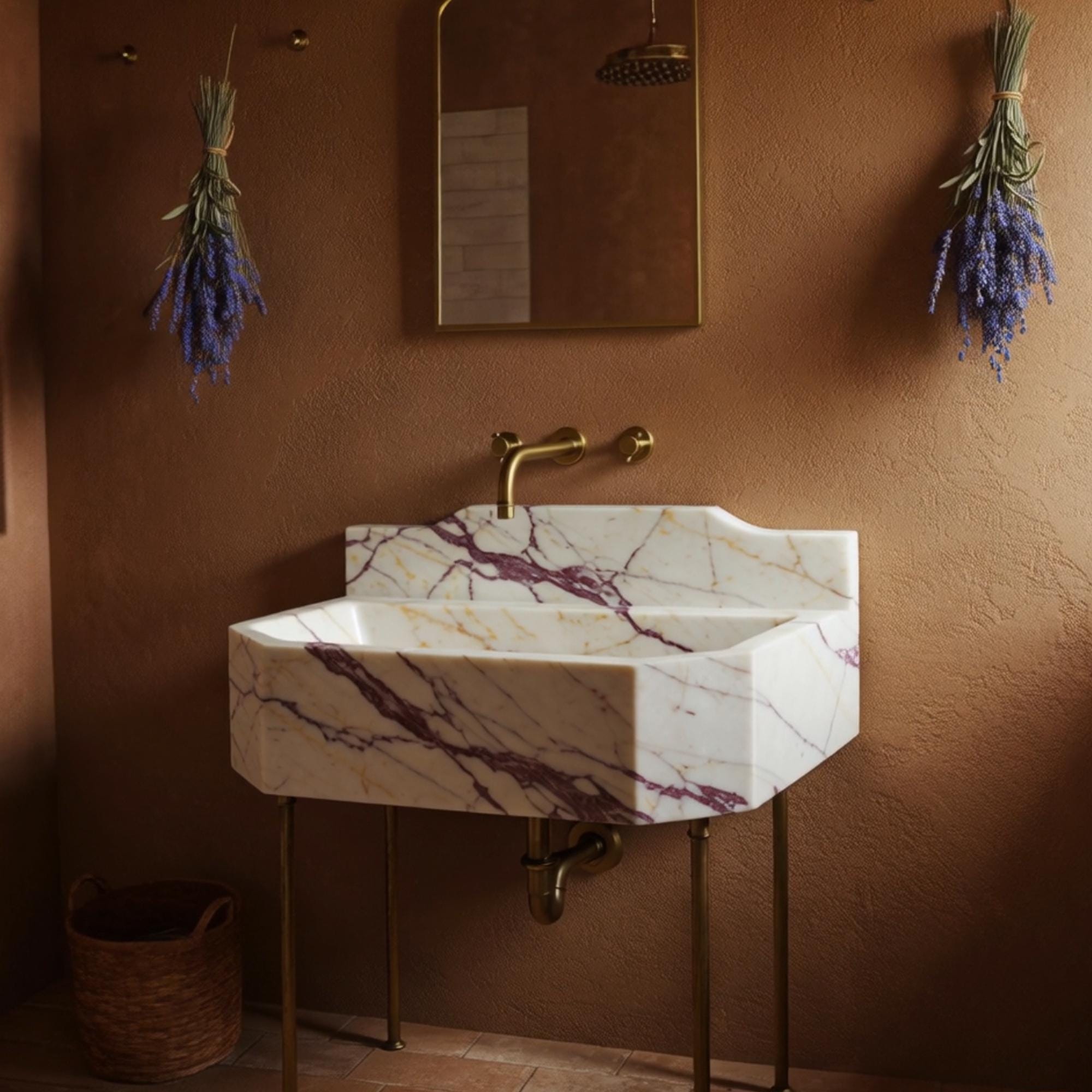 Classic-style octagonal sink in Calacatta Amber Viola marble with brass console and wall-mounted taps.
