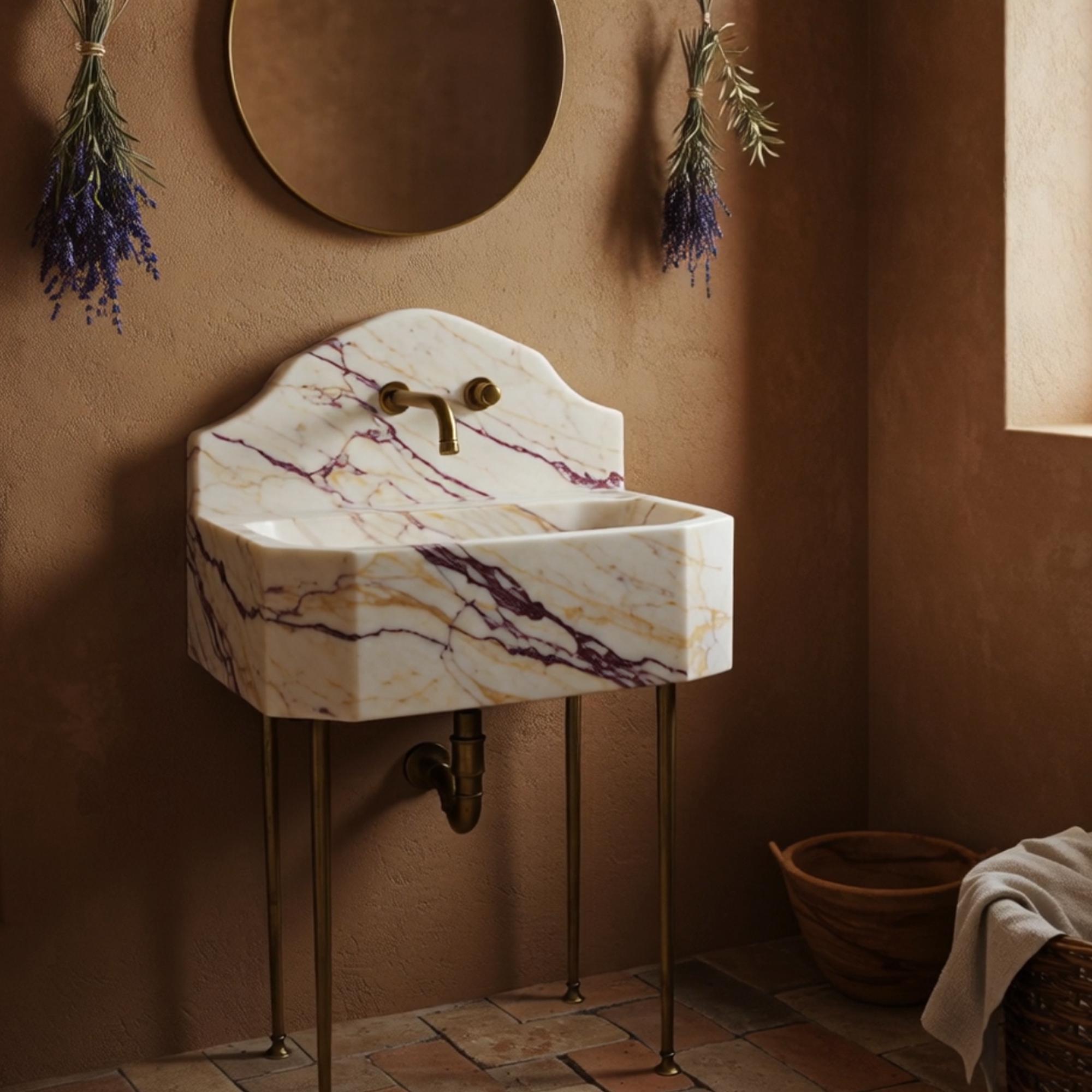 Octagonal bathroom sink in Calacatta Amber Viola marble with sculpted backsplash and brass base.