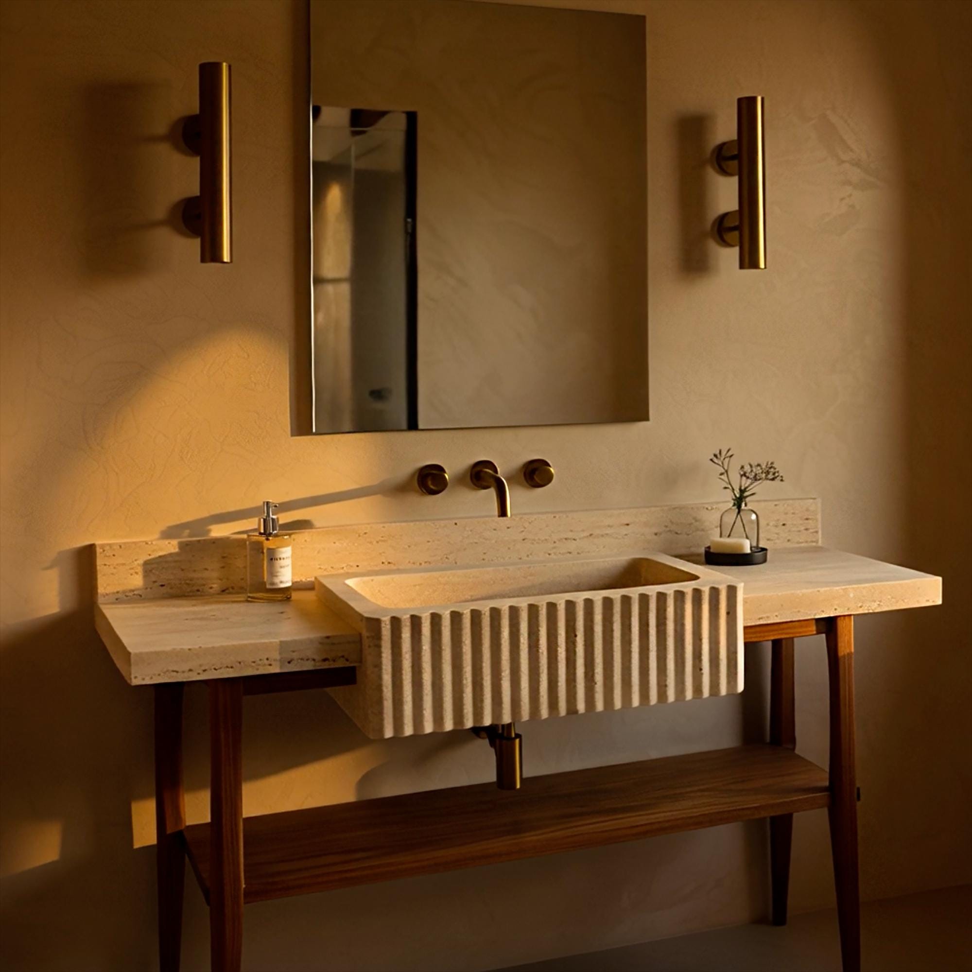 Elegant travertine console sink with carved fluted detailing and open oak shelf, ideal for warm-toned bathrooms.