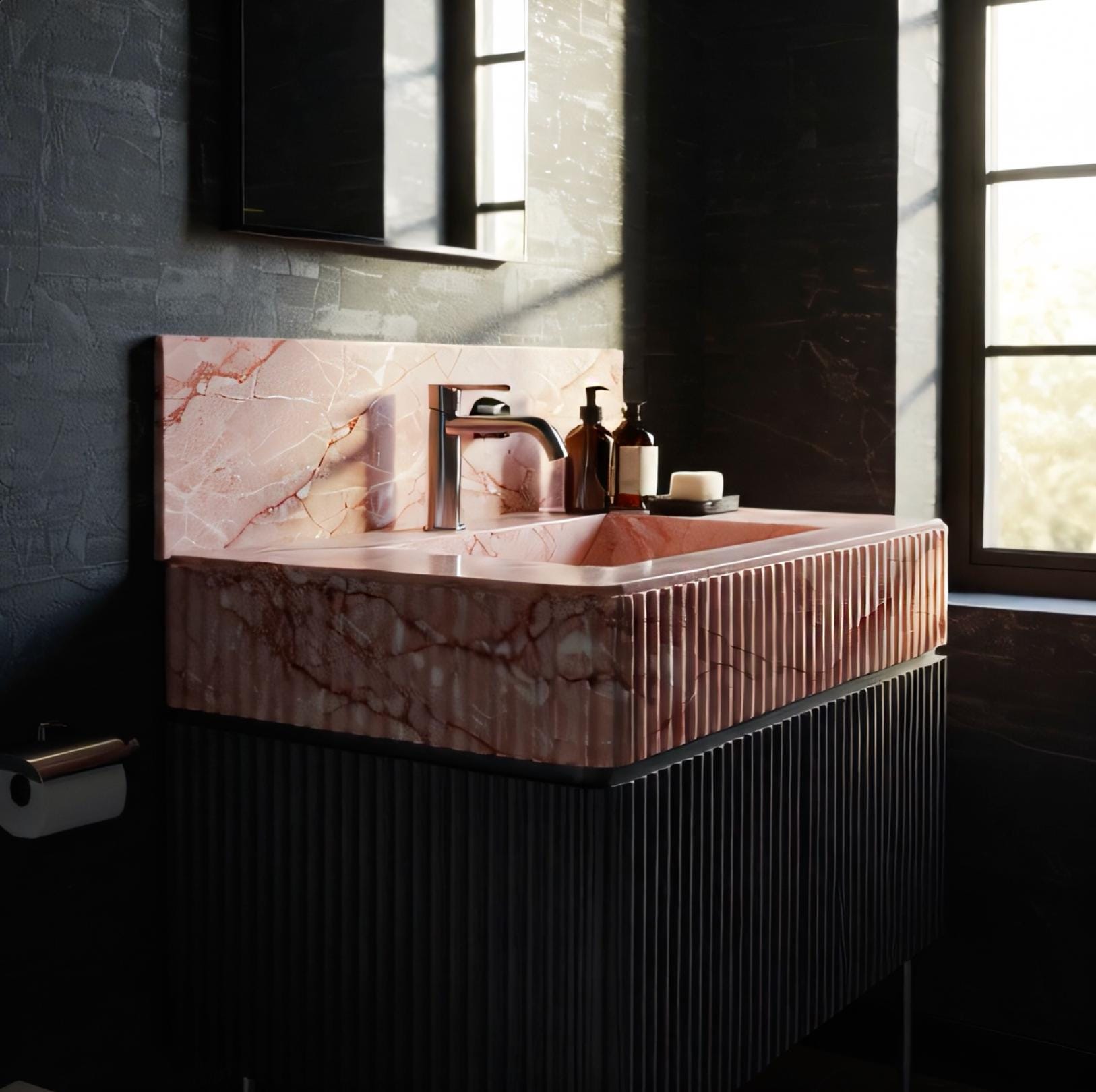 Blush pink marble meets sleek black fluted cabinetry in this refined console sink, designed for modern interiors.