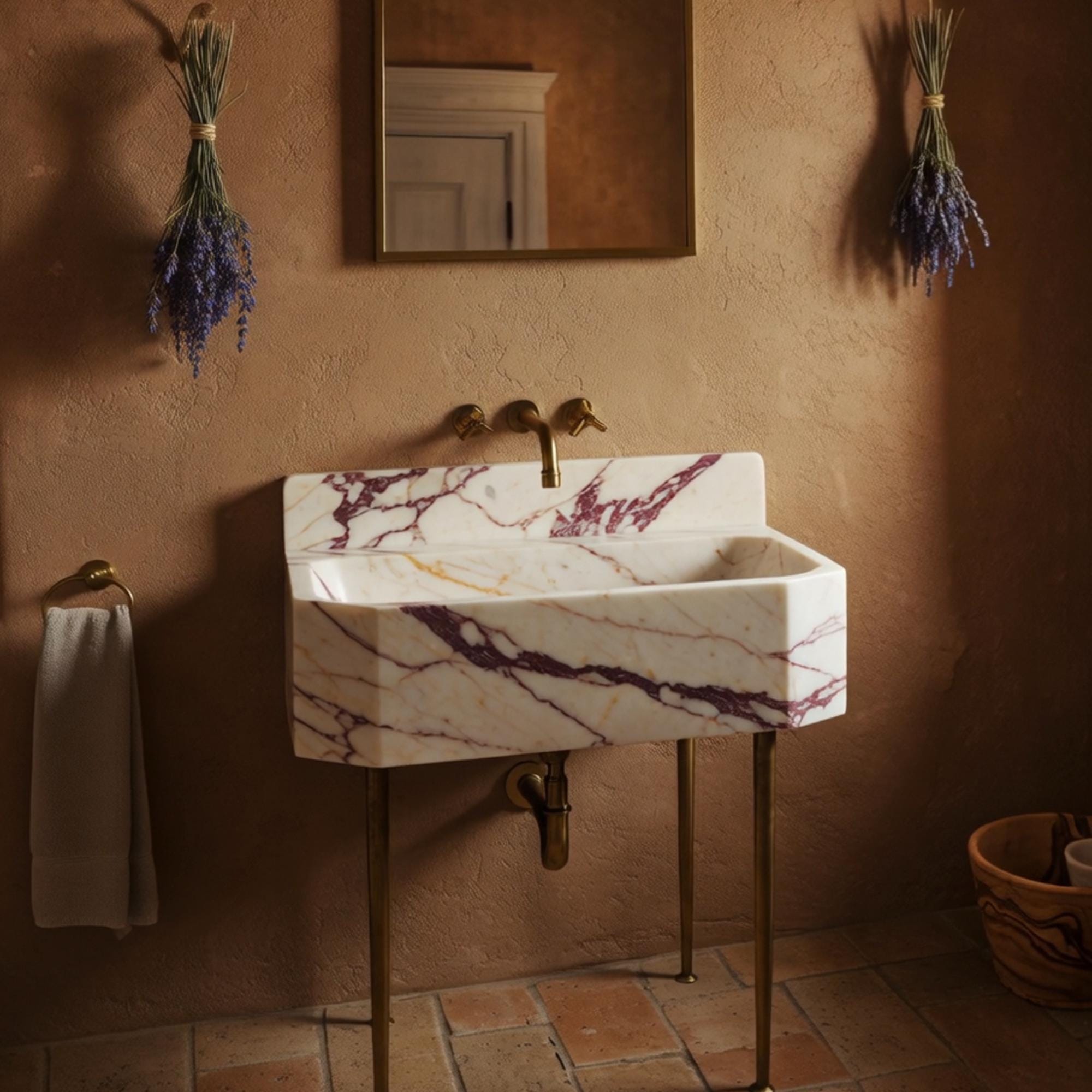 Luxury Calacatta marble bathroom vanity with integrated backsplash and brass frame.