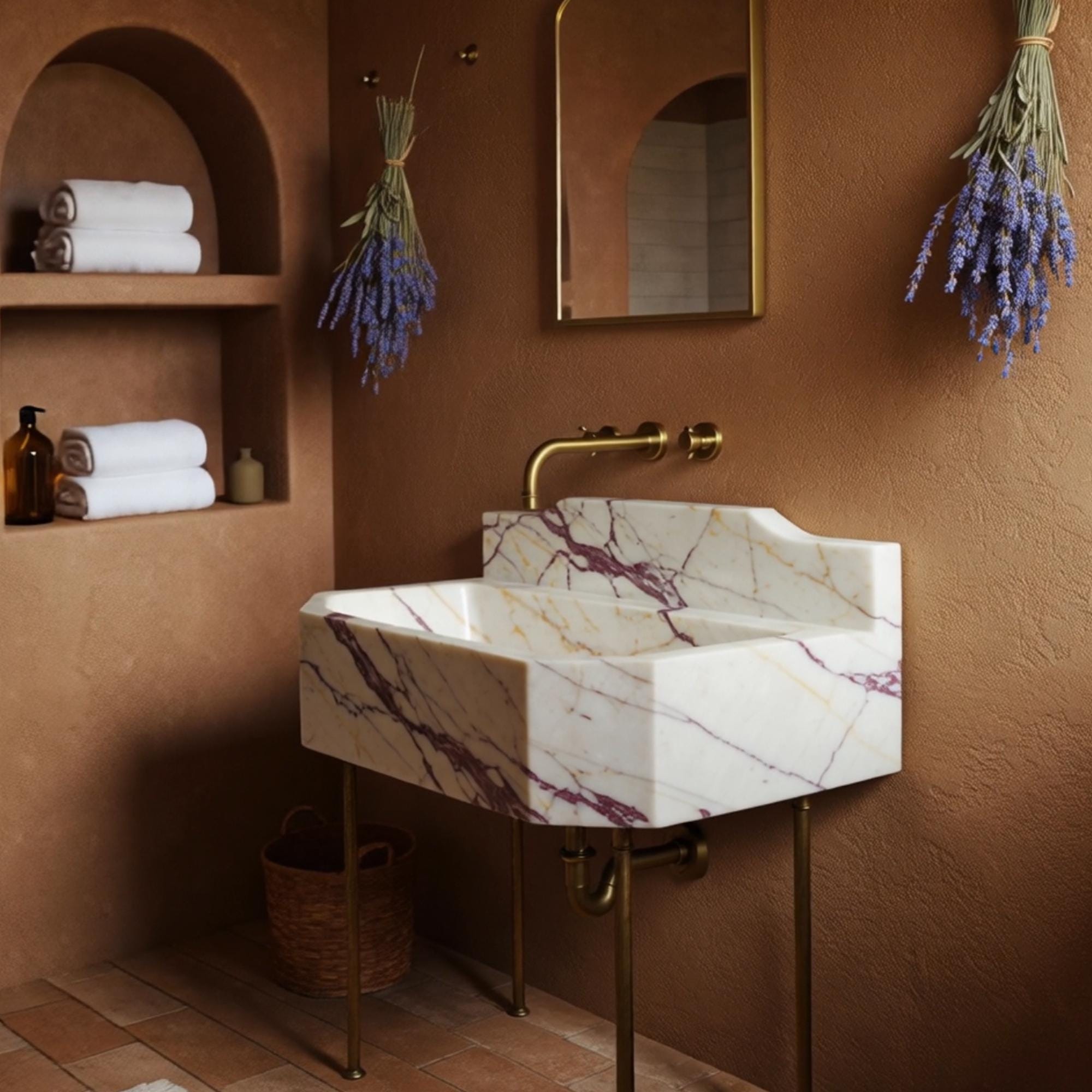 Console sink crafted from Calacatta Amber Viola marble, featuring a raised backsplash and brass legs.