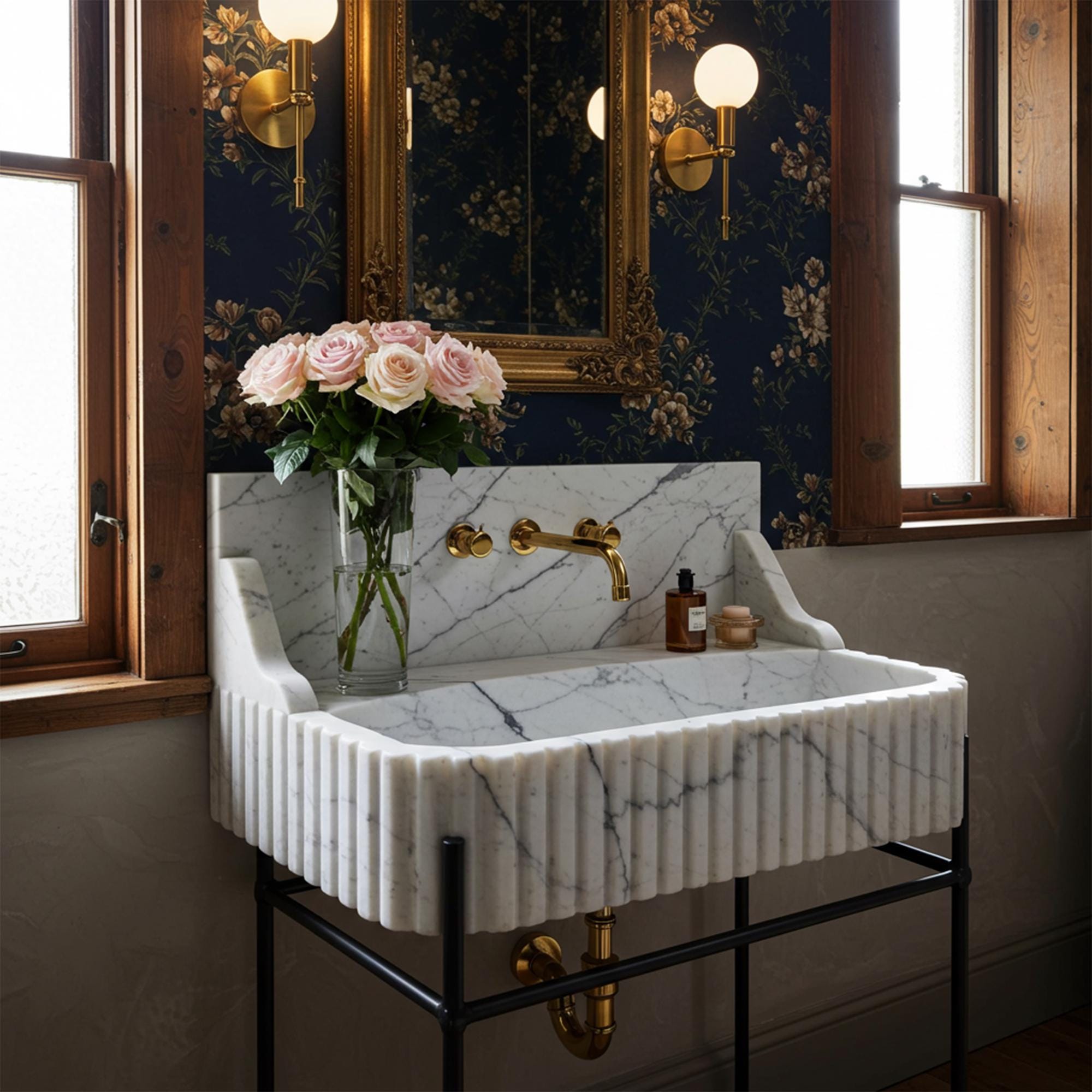 Calacatta marble fluted console sink with integrated backsplash and black metal stand for classic elegance.