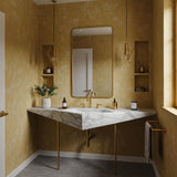 Carrara marble console vanity with asymmetrical geometric stone top and elegant brass stand.