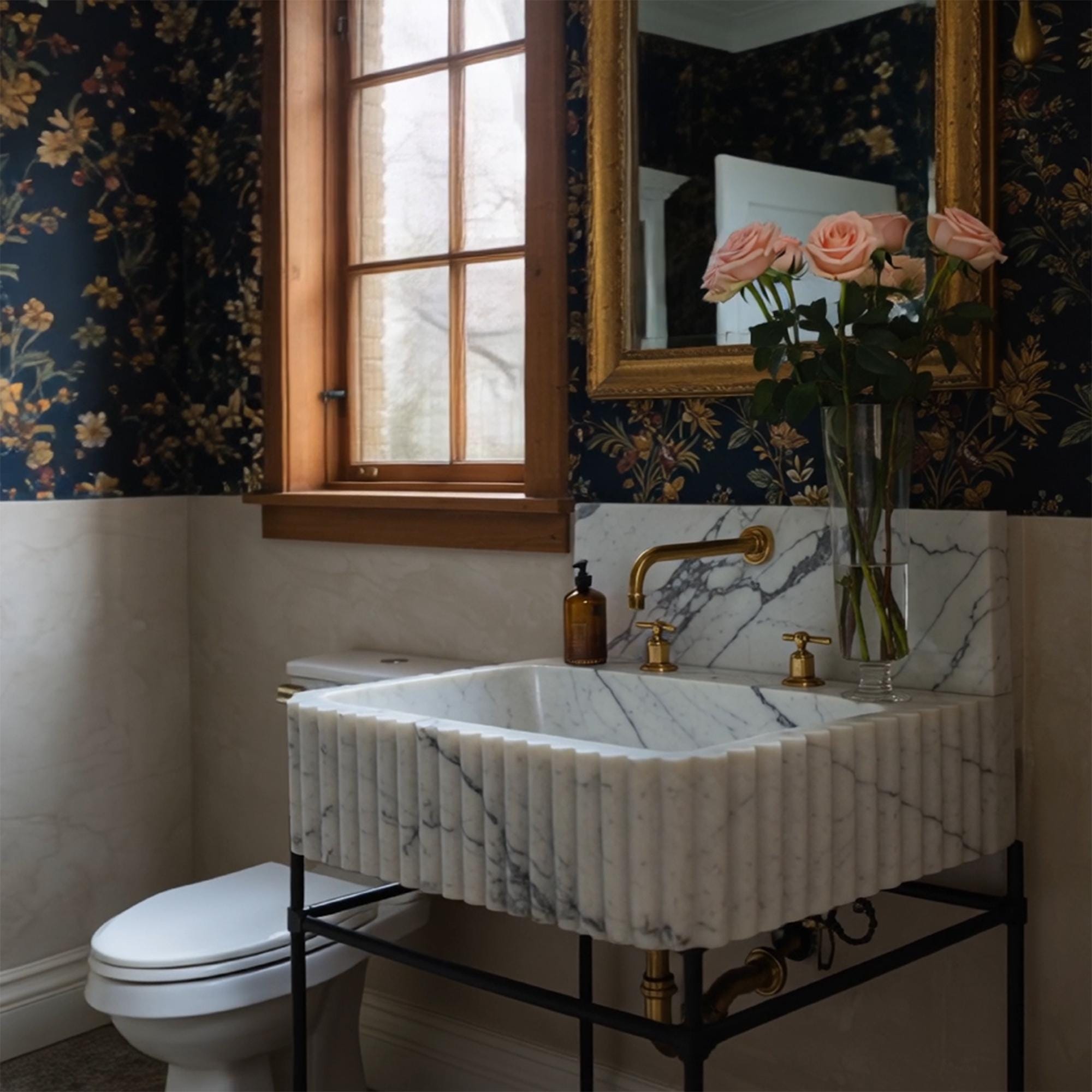 This fluted Calacatta Viola marble sink sits on a black frame, blending classical marble beauty with modern structure.