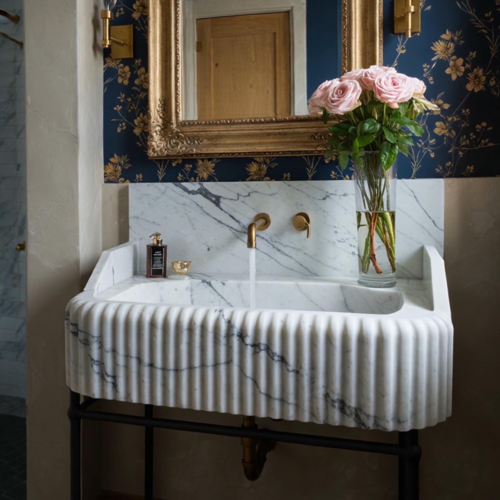 This sculpted Calacatta Viola sink features fluted detailing and raised sides, blending classical beauty with practical luxury.