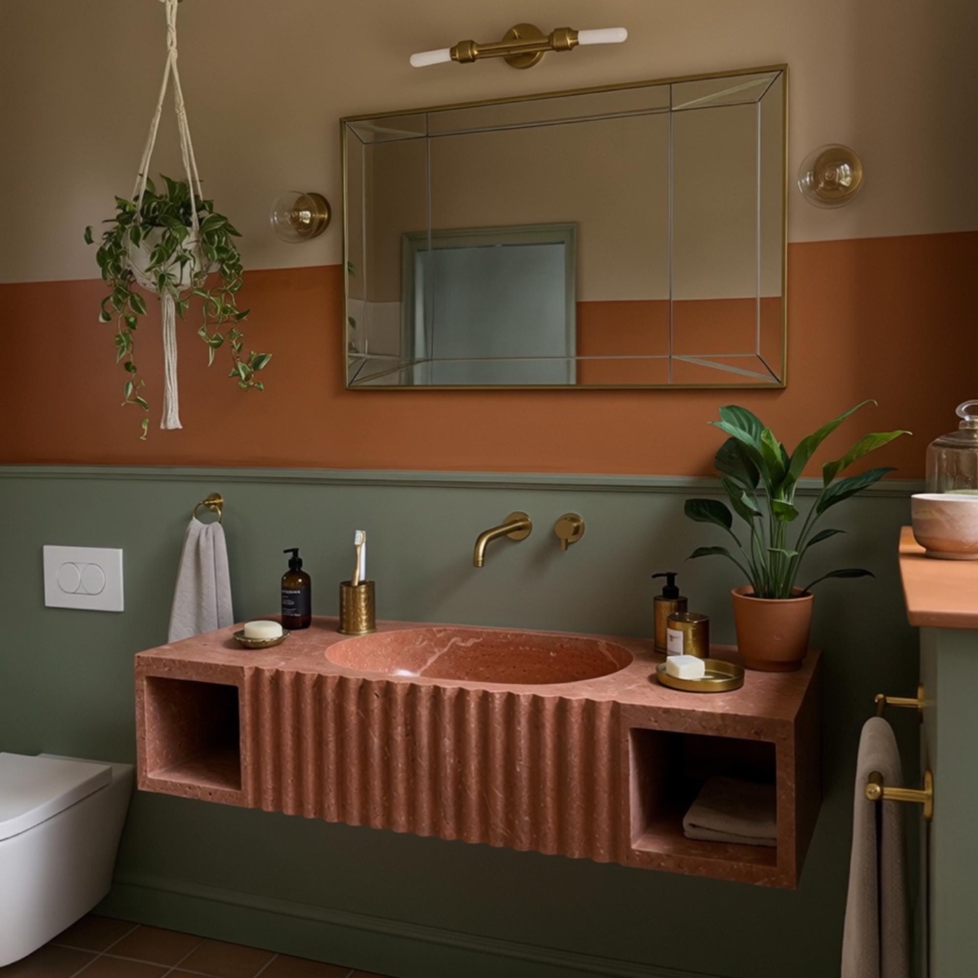 Modern fluted stone vanity in red travertine with integrated sink and dual open storage spaces.