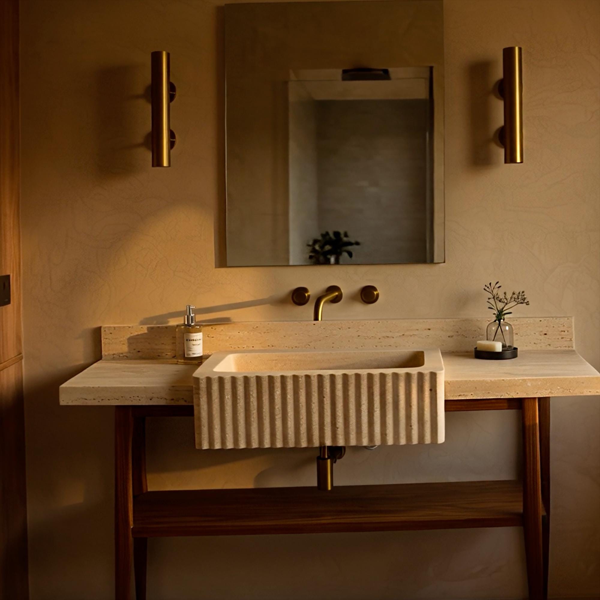 Minimalist console sink in beige travertine with fluted design, featuring a solid oak stand and built-in backsplash.