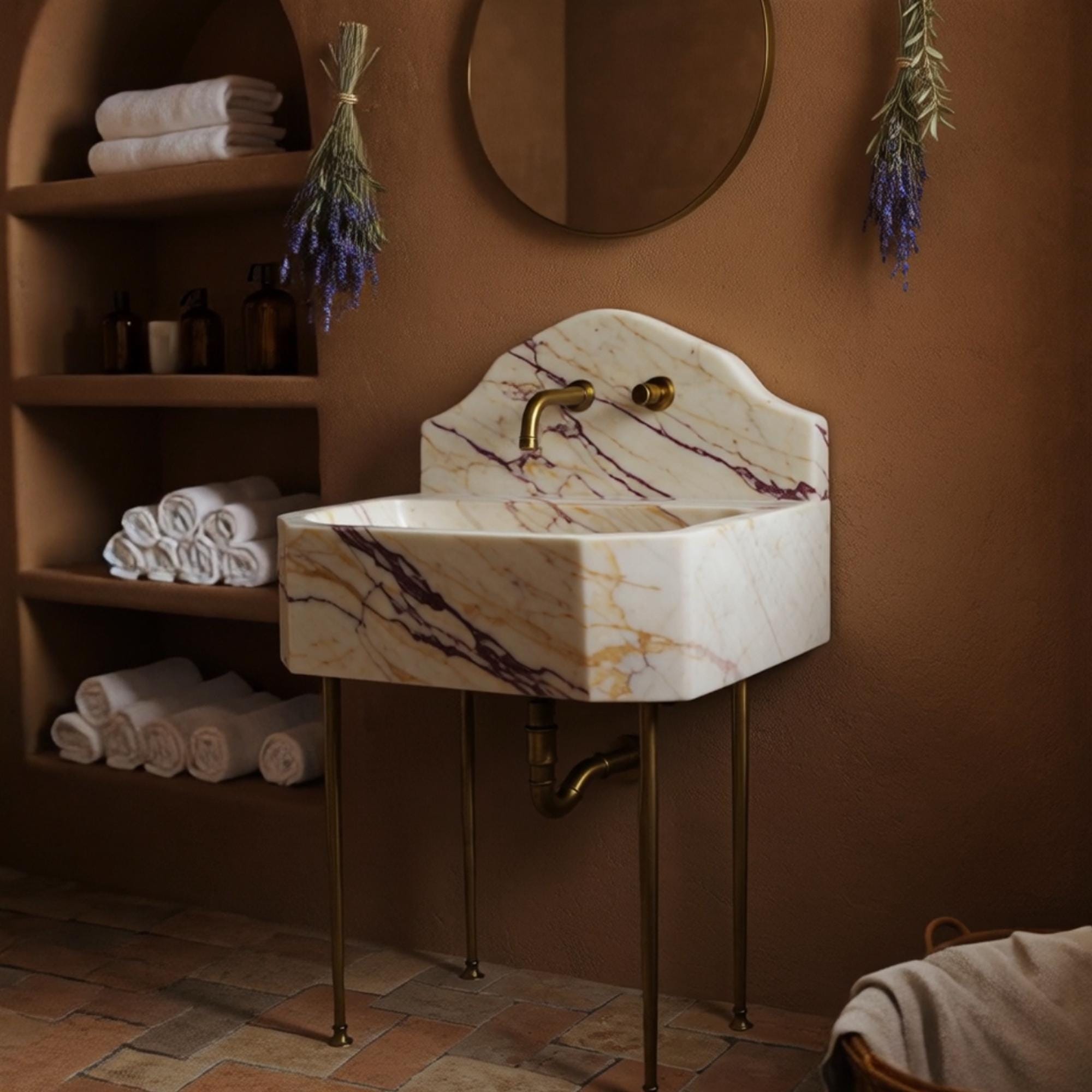 Elegant octagonal sink crafted from Calacatta Amber Viola marble with vivid purple veining and brass console.