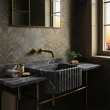 Pietre Notte black marble fluted sink with integrated countertop and elegant brass console base.