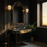 Striking console vanity with Pietre Notte marble top, sculptural gold legs, and a sleek black cabinet.