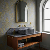 Pietre Notte marble vessel sink with fluted sides, mounted on oak vanity with integrated backsplash.