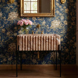 Elegant hand-carved fluted sink in Pink Viola marble, paired with minimalist black metal console legs.