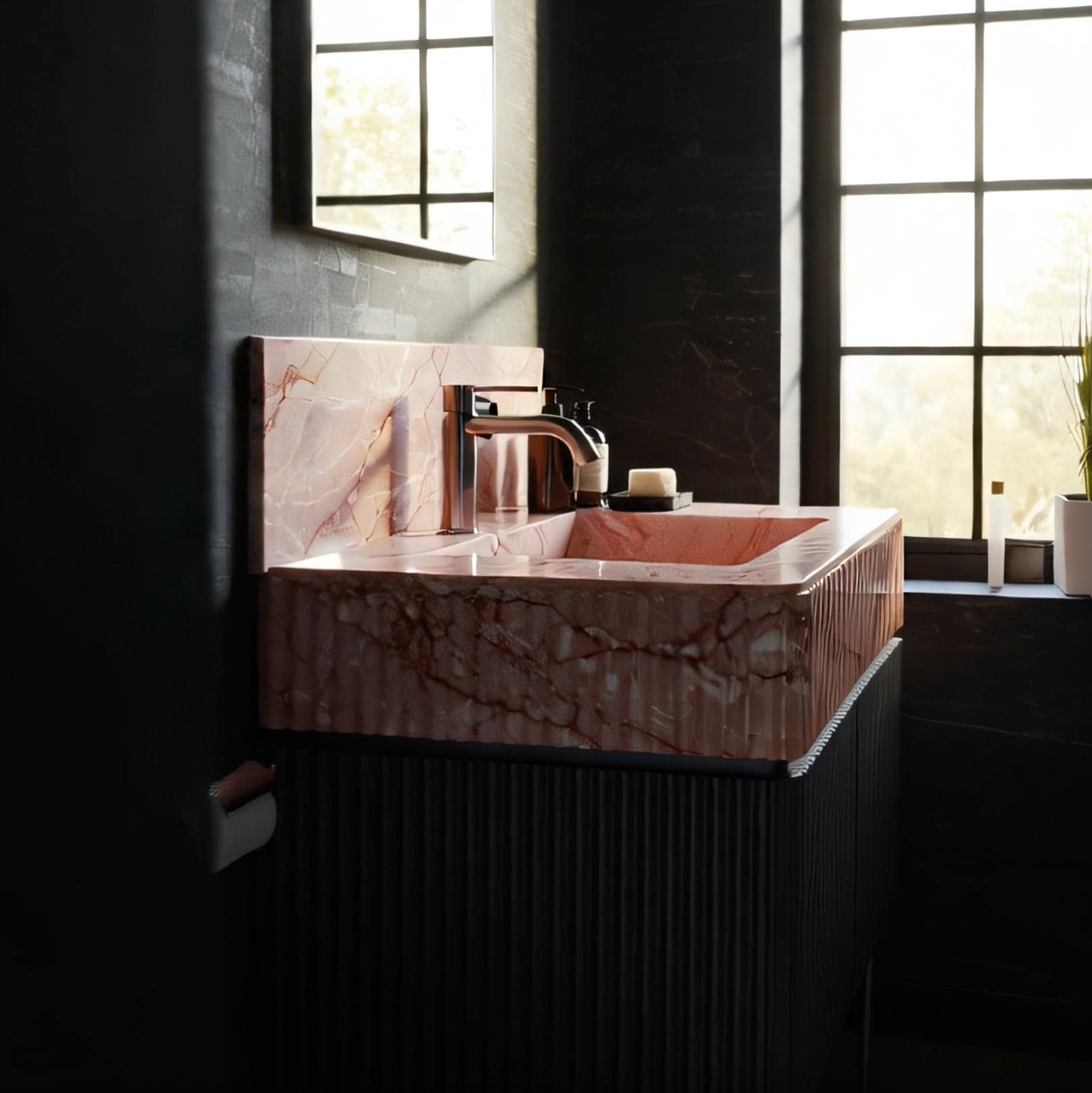 This rose-hued marble sink with vertical fluting sits atop a black grooved vanity, combining texture with modern luxury.