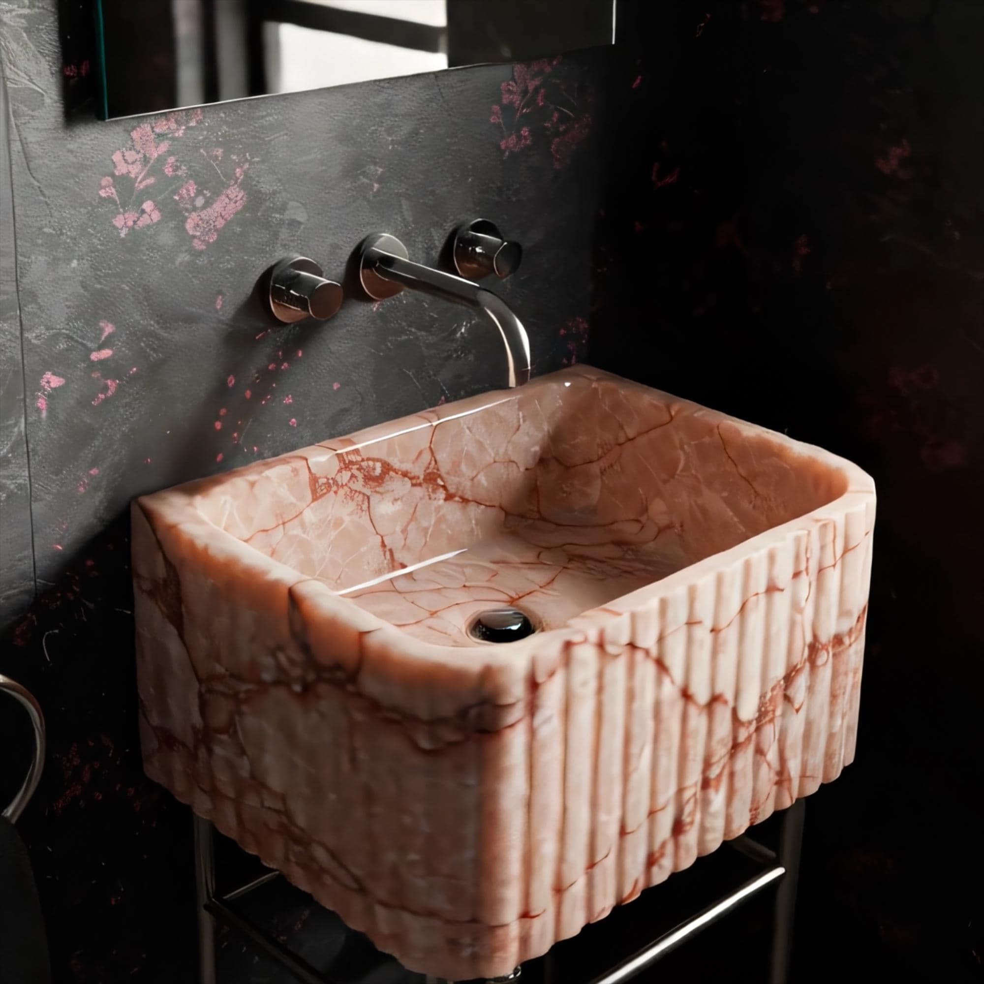 Elegant fluted pink marble sink designed for luxurious small powder room spaces.