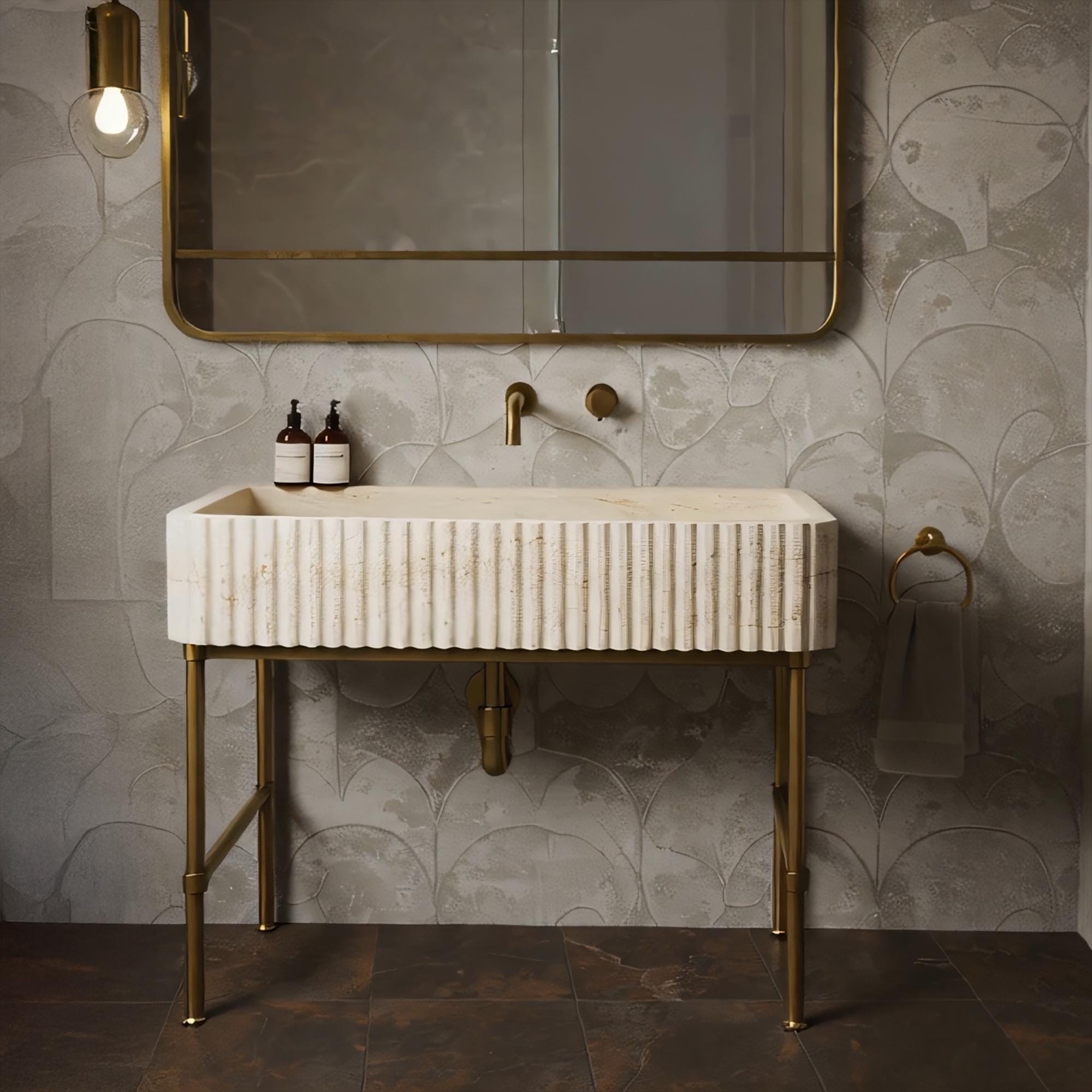 Handcrafted travertine fluted console sink featuring natural beige stone and polished brass metal legs.