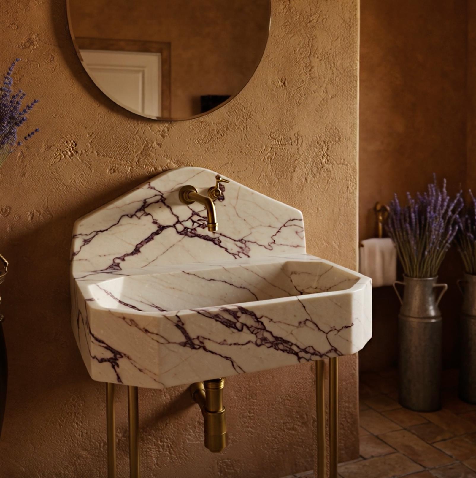 Sophisticated octagonal console sink with Calacatta Viola marble and custom peaked backsplash.